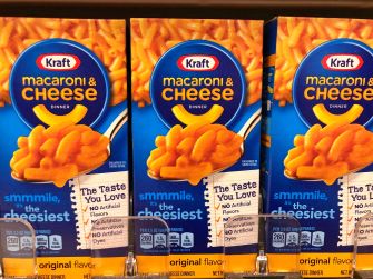 Kraft macaroni and cheese boxes on a store shelf