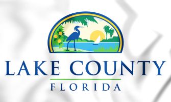 Lake County, Florida emblem featuring a heron, palm trees, and a scenic background.