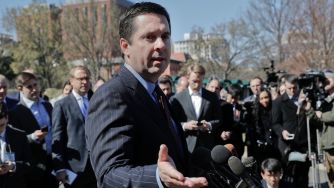Rep. Devin Nunes speaking to a crowd of reporters outside.