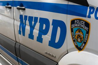 NYPD vehicle showing the department's logo and markings.