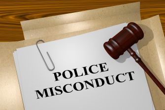Image depicting a document labeled "POLICE MISCONDUCT" alongside a gavel, symbolizing legal matters related to police conduct.