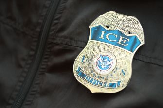 Image of a U.S. Immigration and Customs Enforcement (ICE) officer's badge.