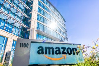 Amazon headquarters building with a prominent company logo.
