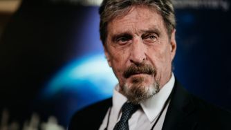 Image of John McAfee, the founder of antivirus software, facing charges for cryptocurrency fraud and money laundering.