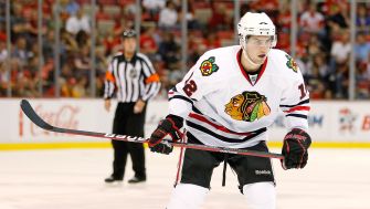 Kyle Beach playing hockey for the Chicago Blackhawks during a game.