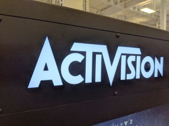 Logo of Activision illuminated on a display.