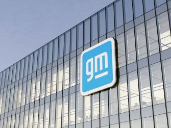 GM logo displayed on a modern building exterior.