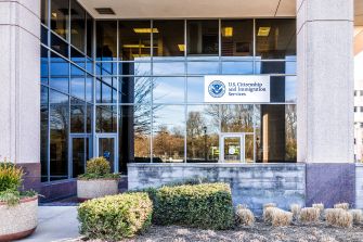 Exterior view of a U.S. Citizenship and Immigration Services office building.