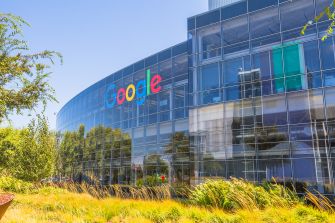 Exterior view of the Google headquarters building with the company logo prominently displayed.