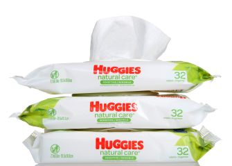 Huggies Natural Care Baby Wipes packaging displaying plant-based imagery and claims about natural ingredients.
