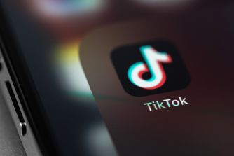 Close-up of the TikTok logo on a smartphone screen.