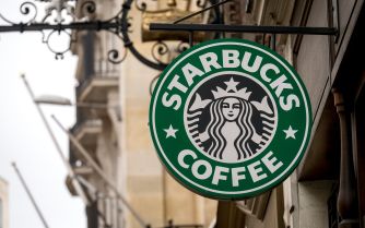Signage of a Starbucks coffee shop featuring the iconic green and white logo.